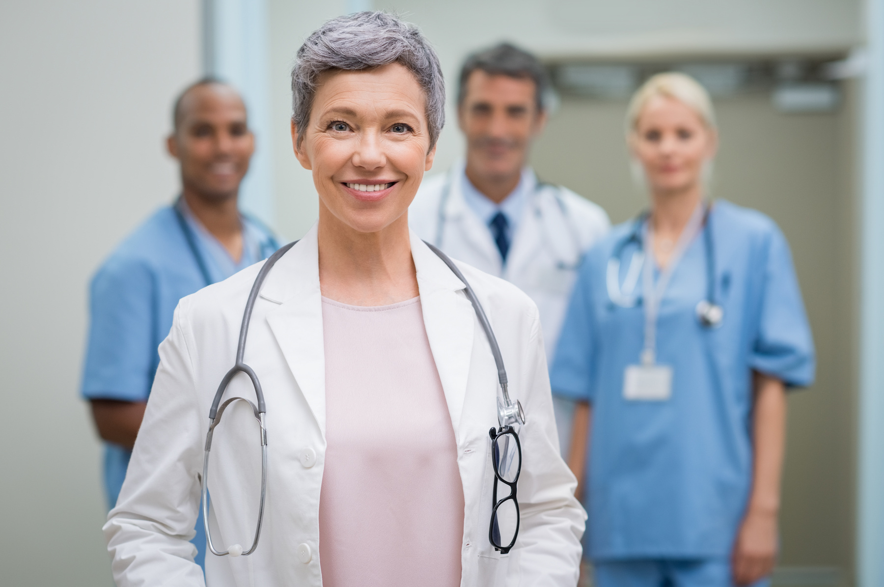 Senior doctor with team